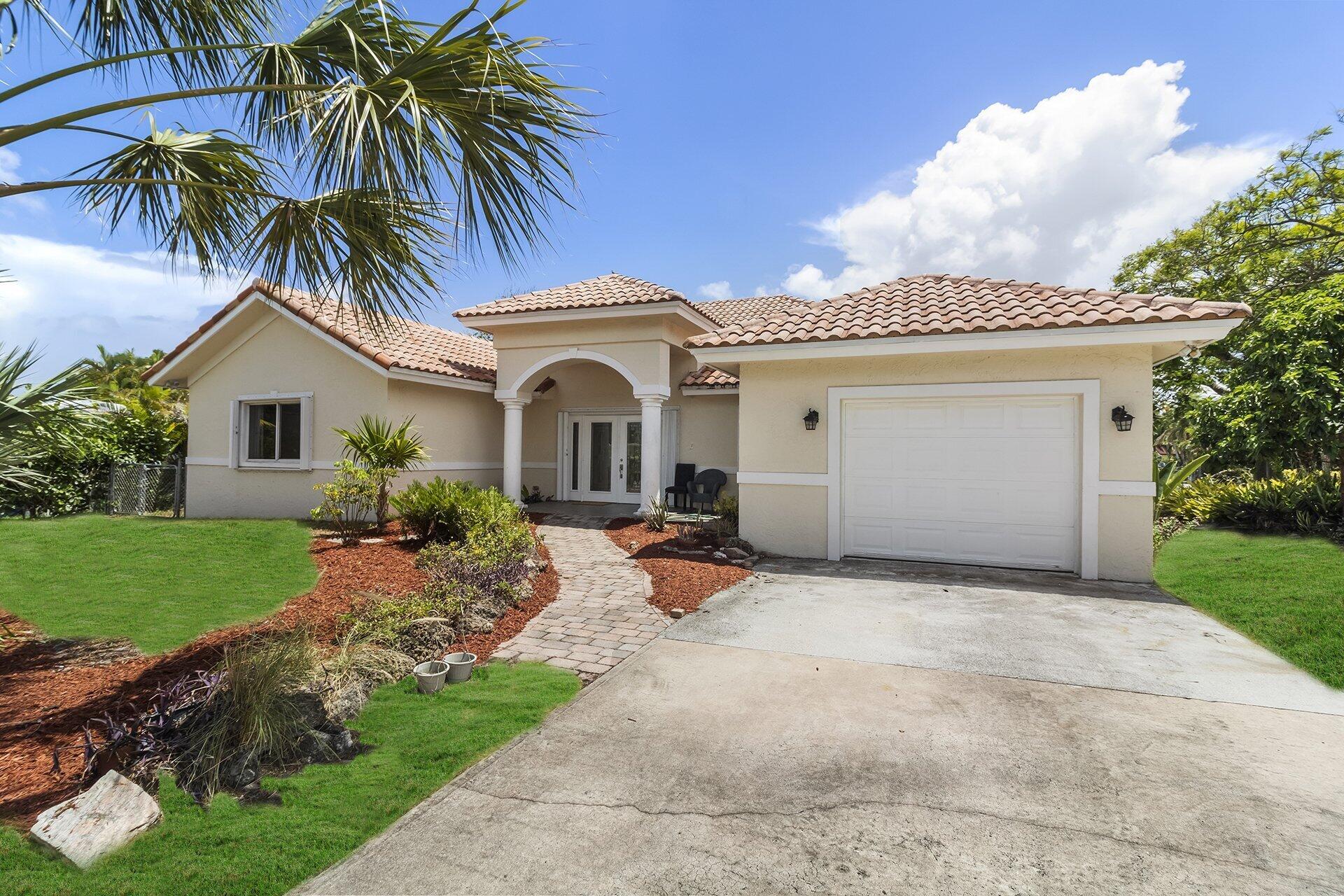 298 Northwest 11th Street Boca Raton, FL 33432 - Photo 4 of 21 a view of a house with a patio