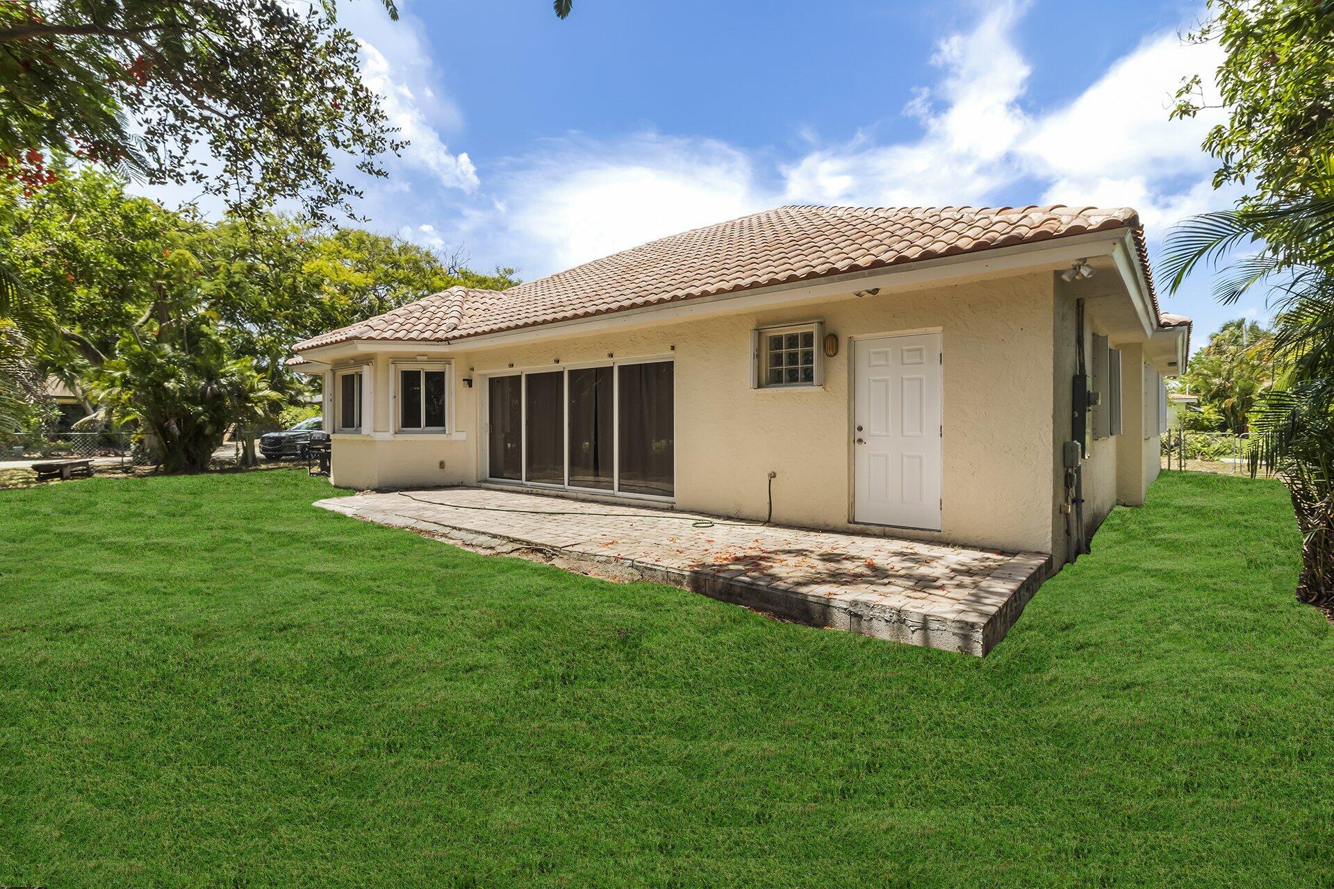 298 Northwest 11th Street Boca Raton, FL 33432 - Photo 5 of 21 a view of a house with a backyard
