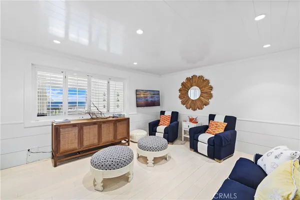 a living room with furniture a window and a dining table