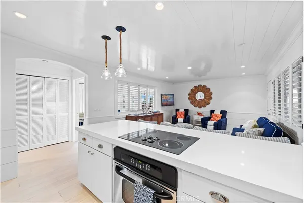 a view of a kitchen with furniture and a chandelier