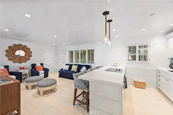 a spacious bedroom with a bed and a large window