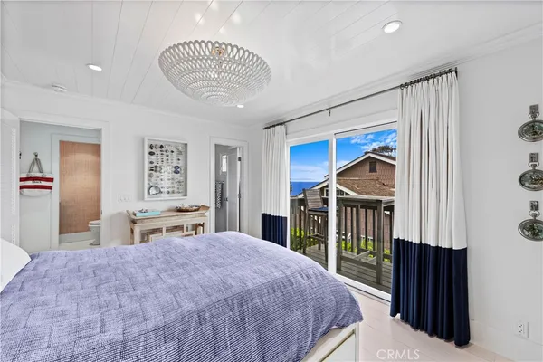 a view of a roof deck with two chairs and a barbeque