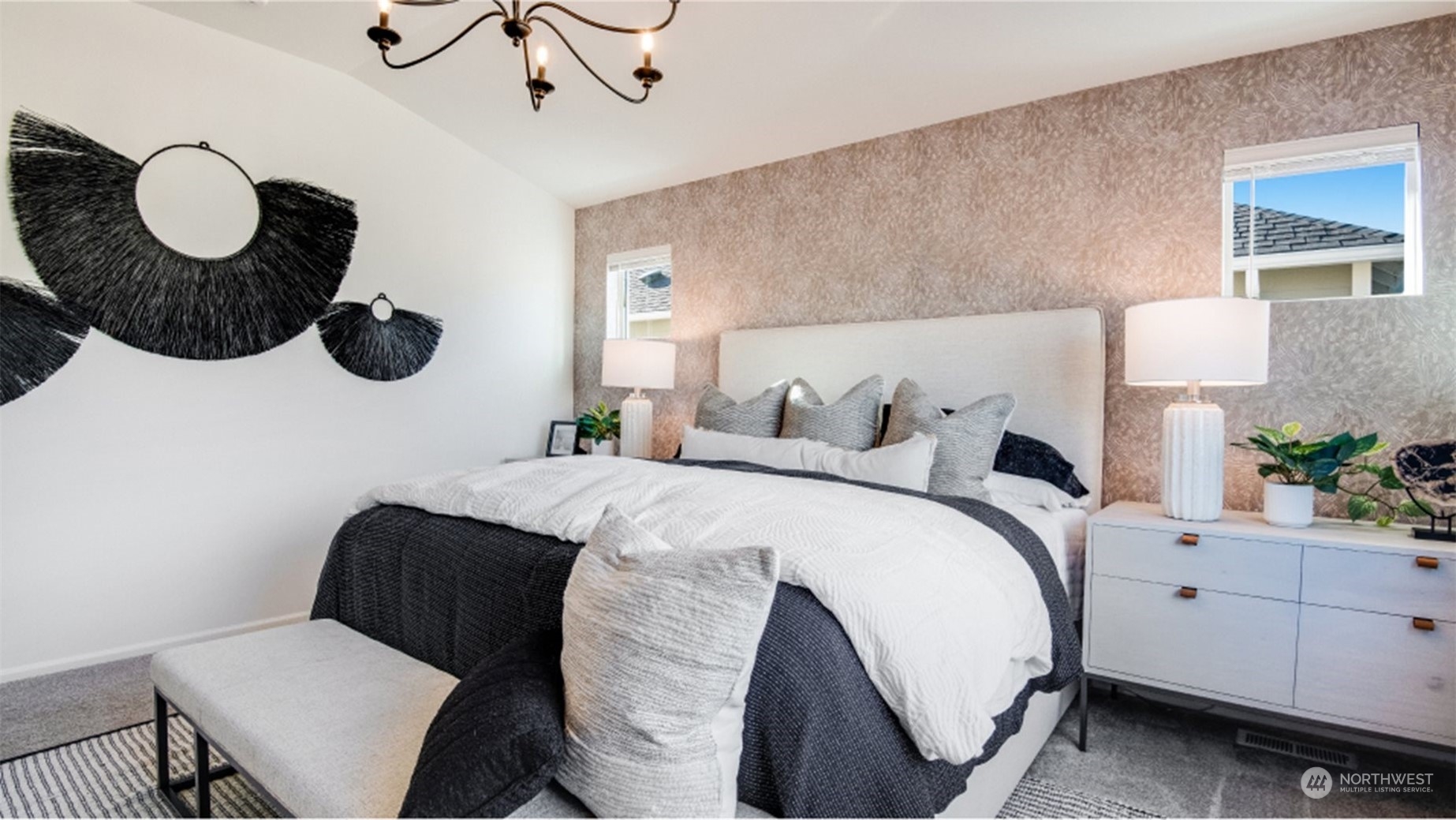 121 179th Street Southeast, Unit 1 Bothell, WA 98012 - Photo 9 of 18 a bedroom with a bed and a chandelier