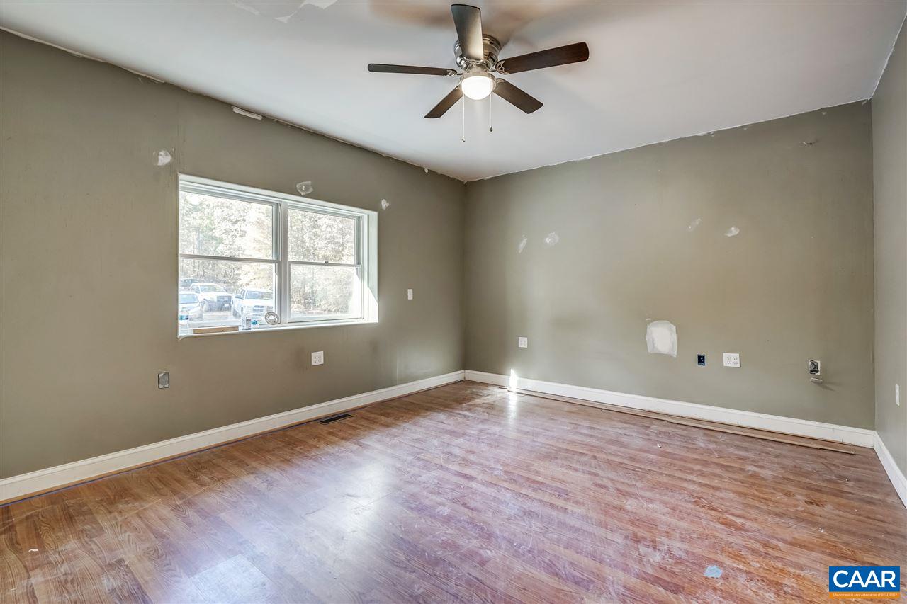 5595 New Line Road Gum Spring, VA 23065 - Photo 11 of 36 wooden floor in an empty room with a window