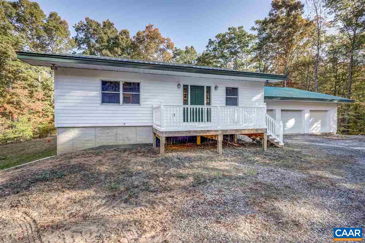 5595 New Line Road Gum Spring, VA 23065 - Photo 2 of 36 a view of a house with a yard and roof