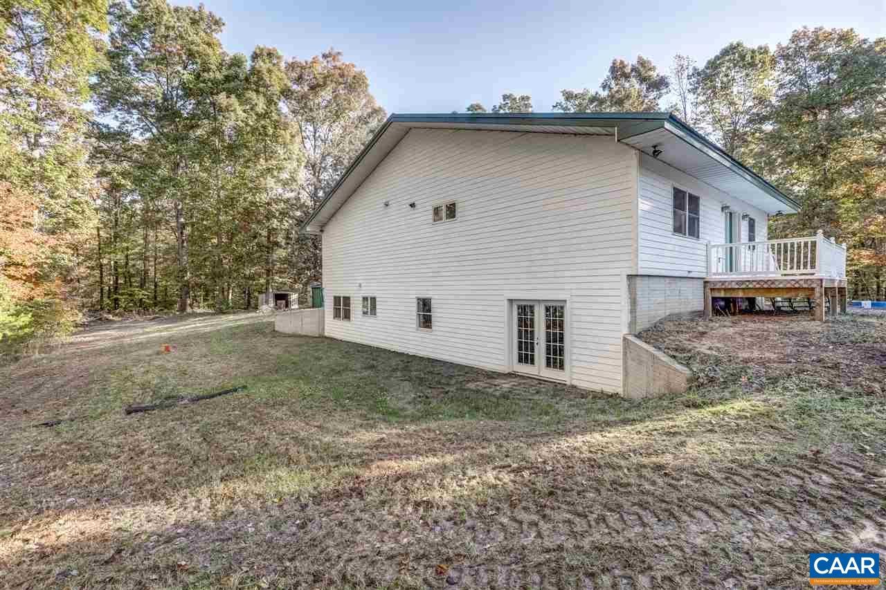 5595 New Line Road Gum Spring, VA 23065 - Photo 22 of 36 a view of a house with a yard