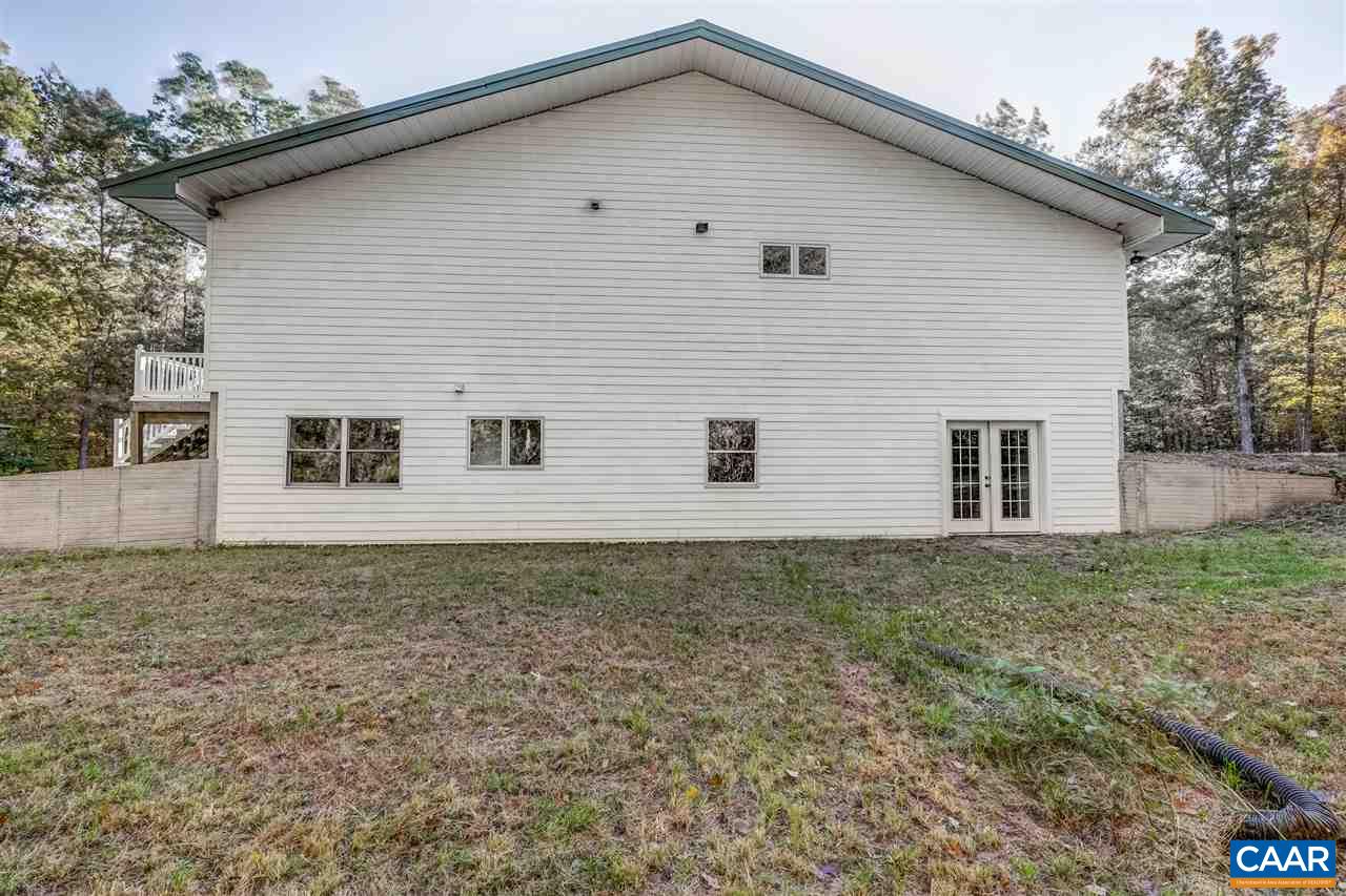 5595 New Line Road Gum Spring, VA 23065 - Photo 23 of 36 a view of a house with a yard