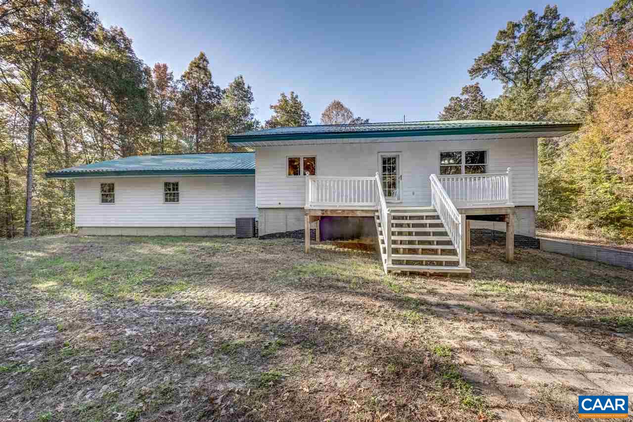 5595 New Line Road Gum Spring, VA 23065 - Photo 25 of 36 a view of a house with a yard and chairs