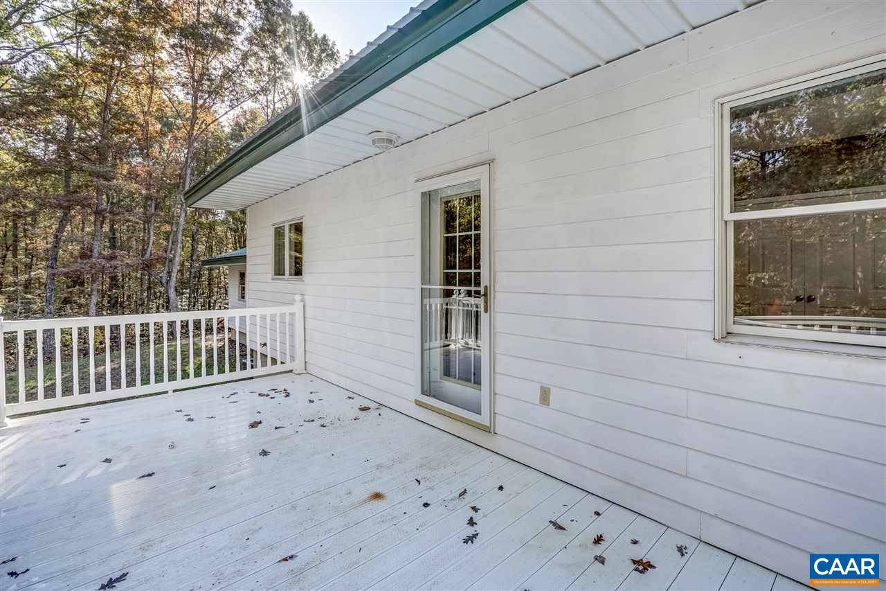 5595 New Line Road Gum Spring, VA 23065 - Photo 27 of 36 a view of a porch with a bench