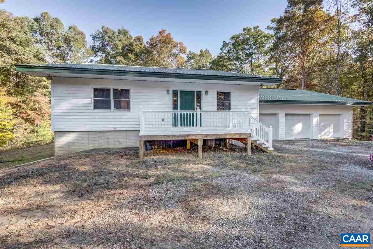5595 New Line Road Gum Spring, VA 23065 - Photo 29 of 36 a view of a house with a yard and large tree