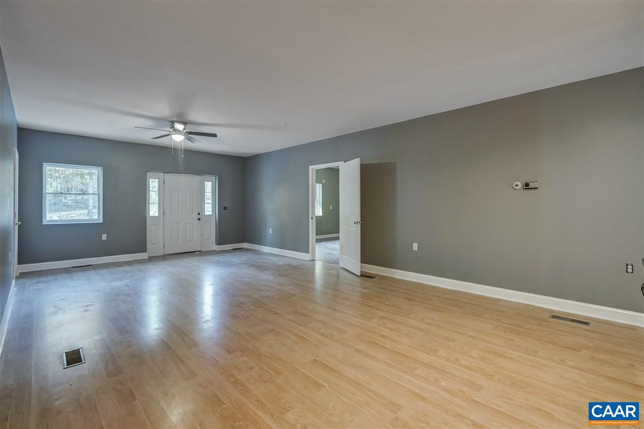 5595 New Line Road Gum Spring, VA 23065 - Photo 3 of 36 a view of an empty room with window and wooden floor