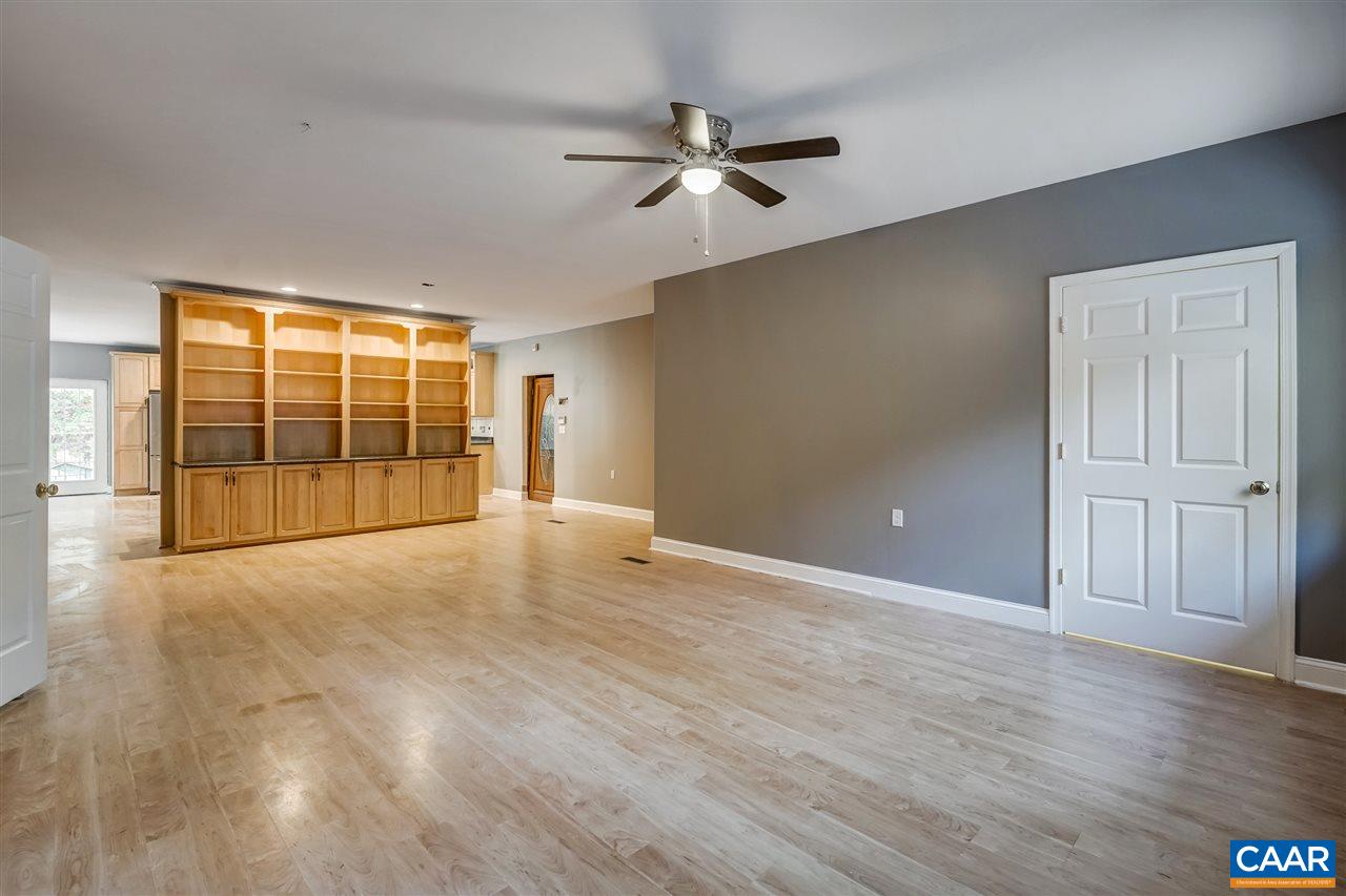 5595 New Line Road Gum Spring, VA 23065 - Photo 4 of 36 a view of an empty room with a window and wooden floor