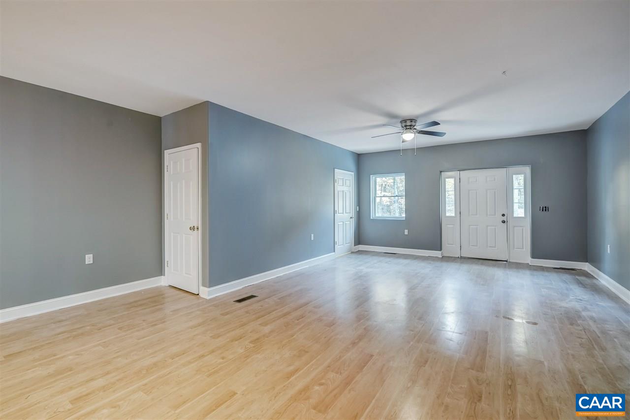 5595 New Line Road Gum Spring, VA 23065 - Photo 5 of 36 a view of an empty room with window and wooden floor