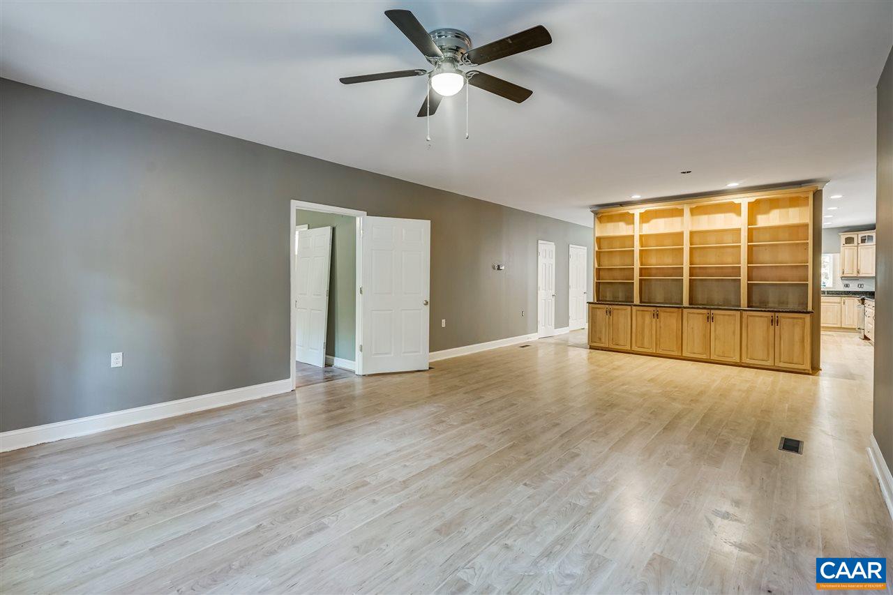 5595 New Line Road Gum Spring, VA 23065 - Photo 6 of 36 a view of an empty room with a window and wooden floor