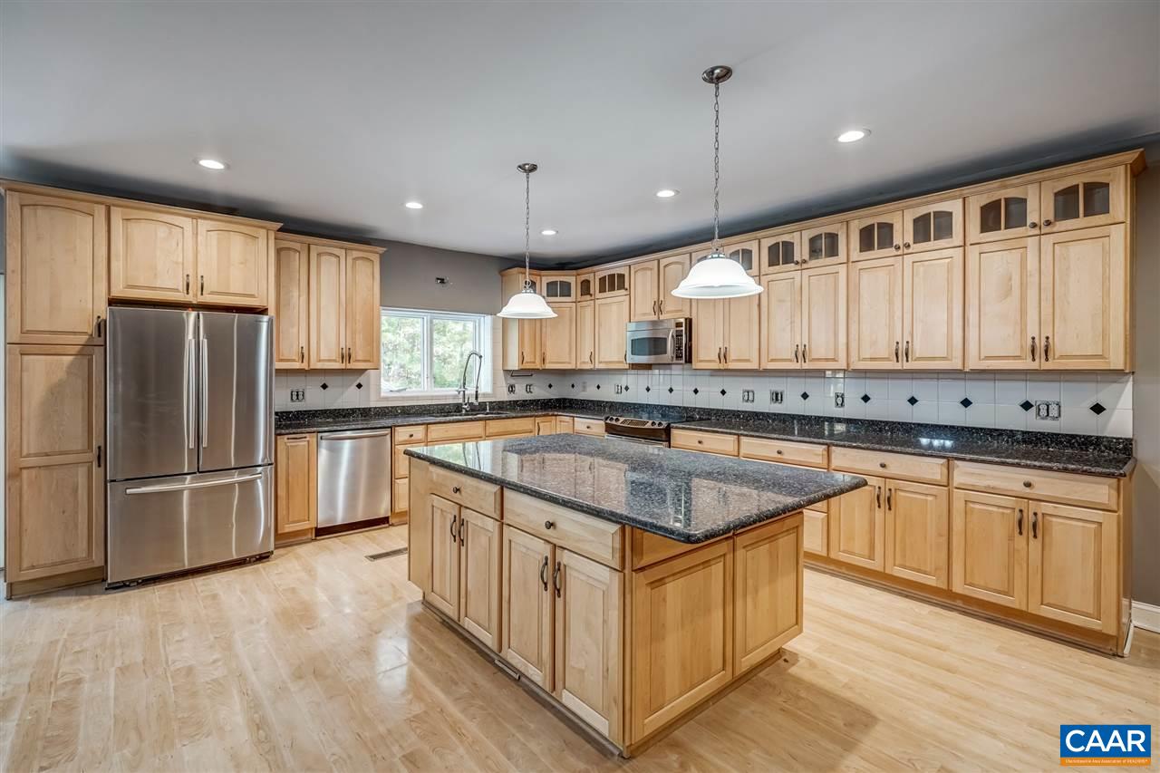 5595 New Line Road Gum Spring, VA 23065 - Photo 10 of 36 a kitchen with granite countertop a sink a counter space stainless steel appliances and cabinets