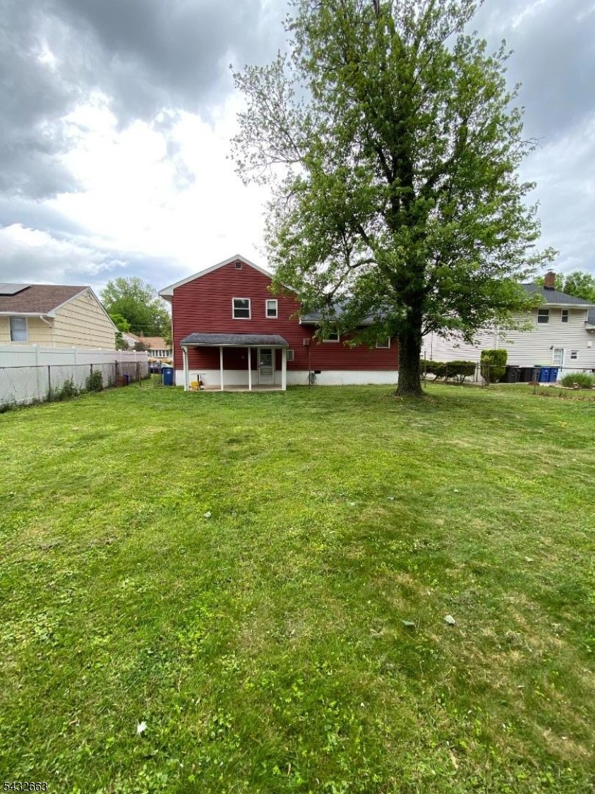 721 Lawrence Road Bound Brook, NJ 08805 - Photo 21 of 21 a front view of a house with a garden