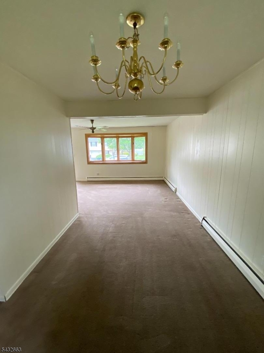 721 Lawrence Road Bound Brook, NJ 08805 - Photo 4 of 21 a view of a chandelier fan and windows in a room