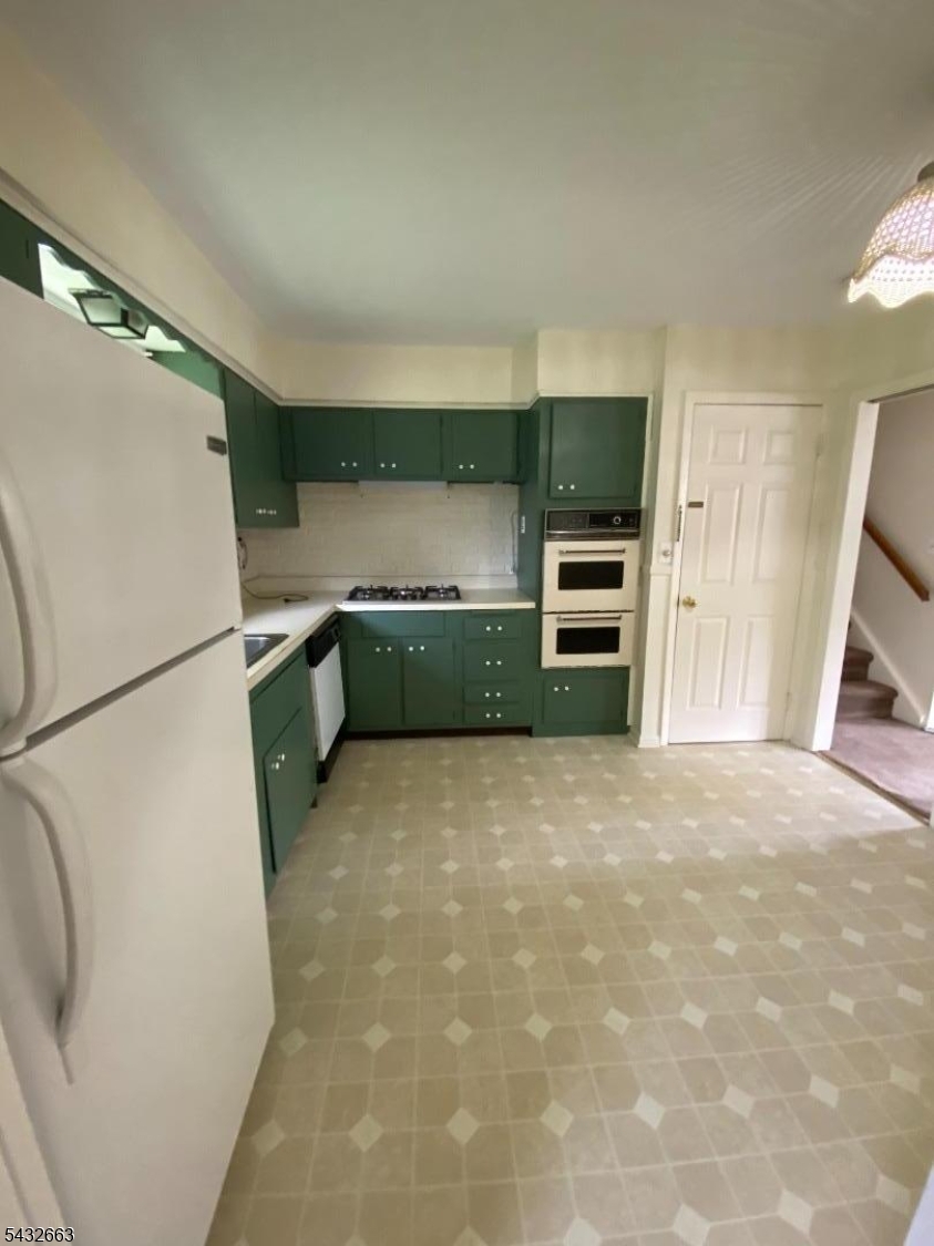 721 Lawrence Road Bound Brook, NJ 08805 - Photo 5 of 21 a kitchen with a refrigerator and a sink