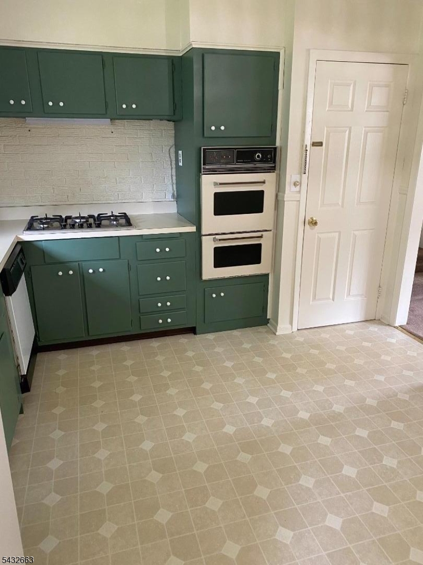 721 Lawrence Road Bound Brook, NJ 08805 - Photo 6 of 21 a kitchen with a cabinets and a stove