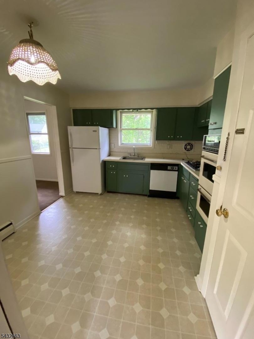 721 Lawrence Road Bound Brook, NJ 08805 - Photo 8 of 21 a room with a fireplace and a view of living room