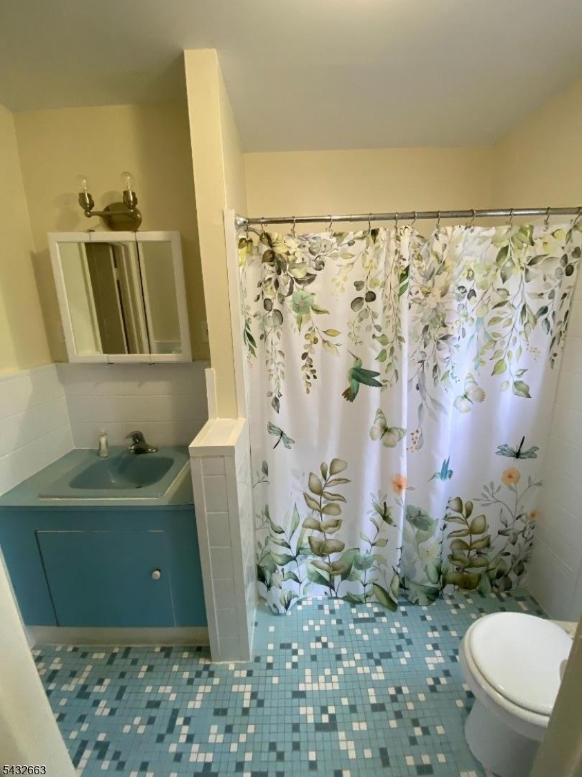 721 Lawrence Road Bound Brook, NJ 08805 - Photo 9 of 21 a bathroom with a sink and toilet