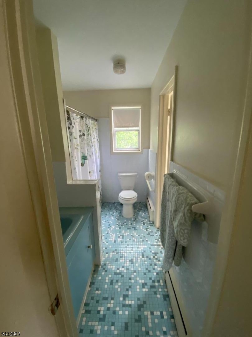 721 Lawrence Road Bound Brook, NJ 08805 - Photo 10 of 21 a bathroom with a granite countertop sink a toilet and shower
