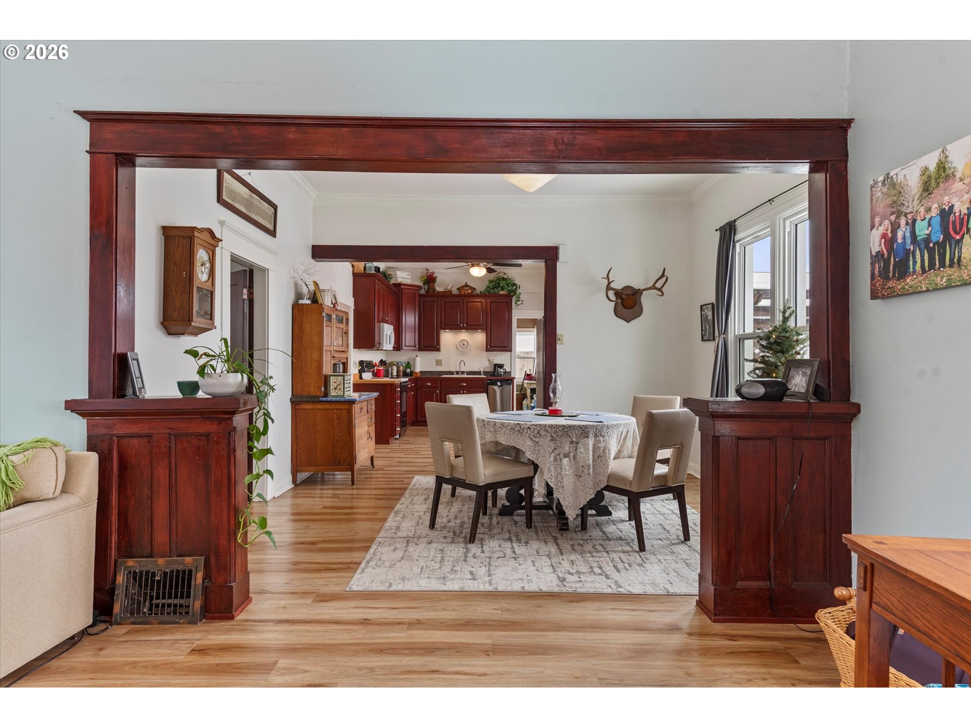 1439 3rd Street Baker City, OR 97814 - Photo 15 of 42 a living room with furniture a dining table and paintings on the wall