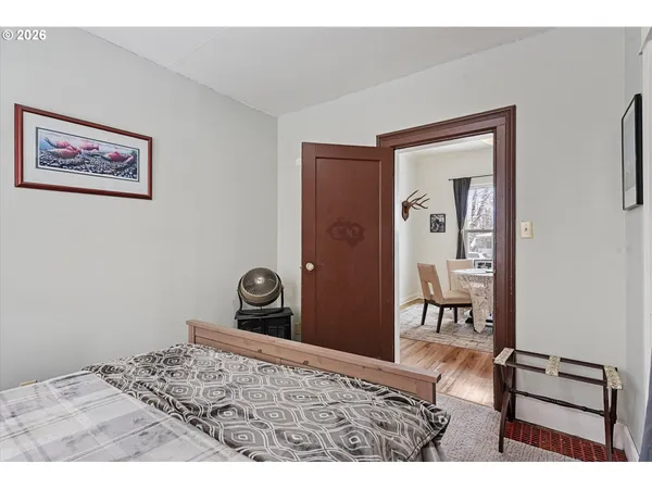 a bedroom with a bed and a table in it