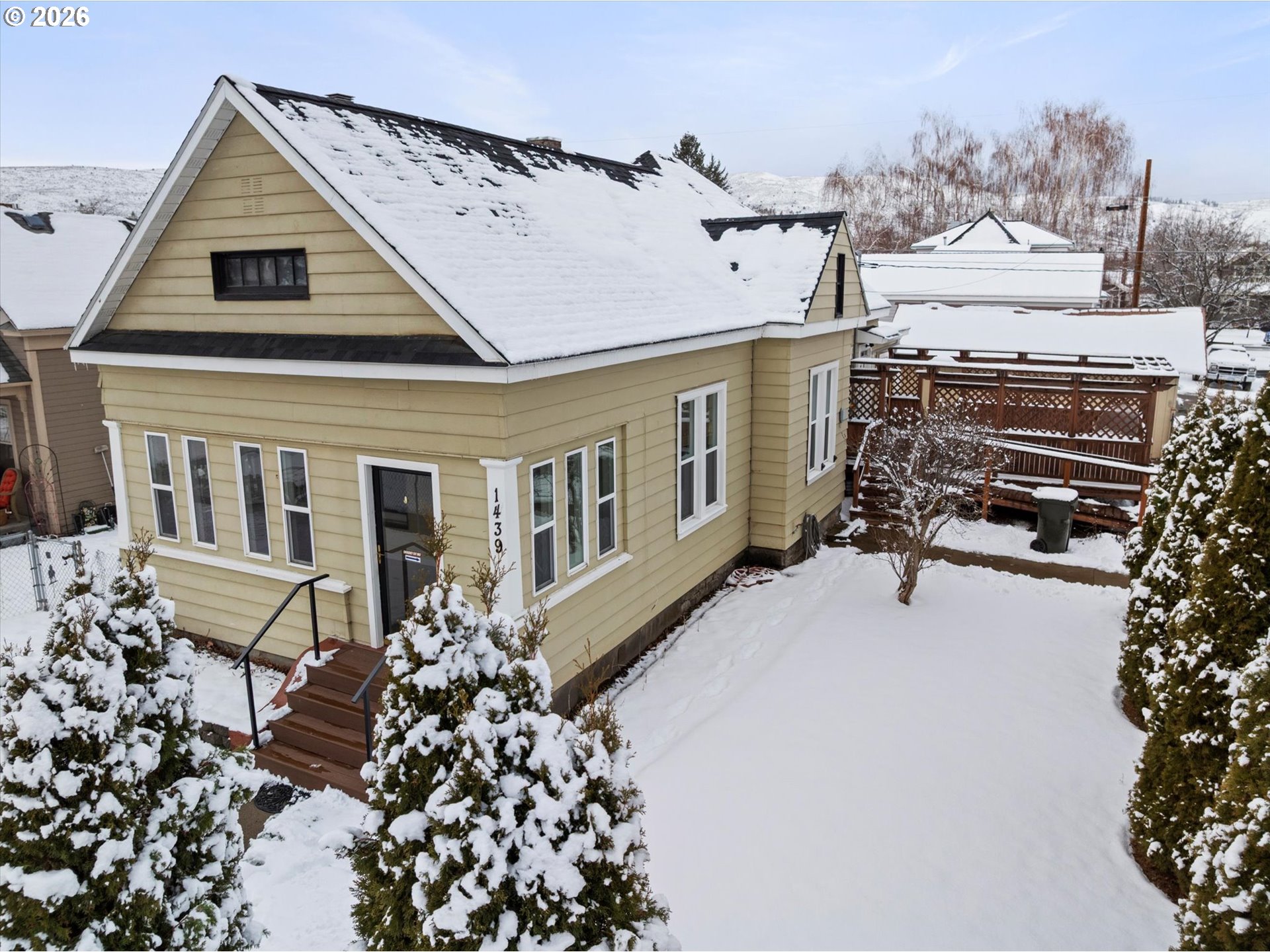 1439 3rd Street Baker City, OR 97814 - Photo 3 of 42 a front view of a house with a yard