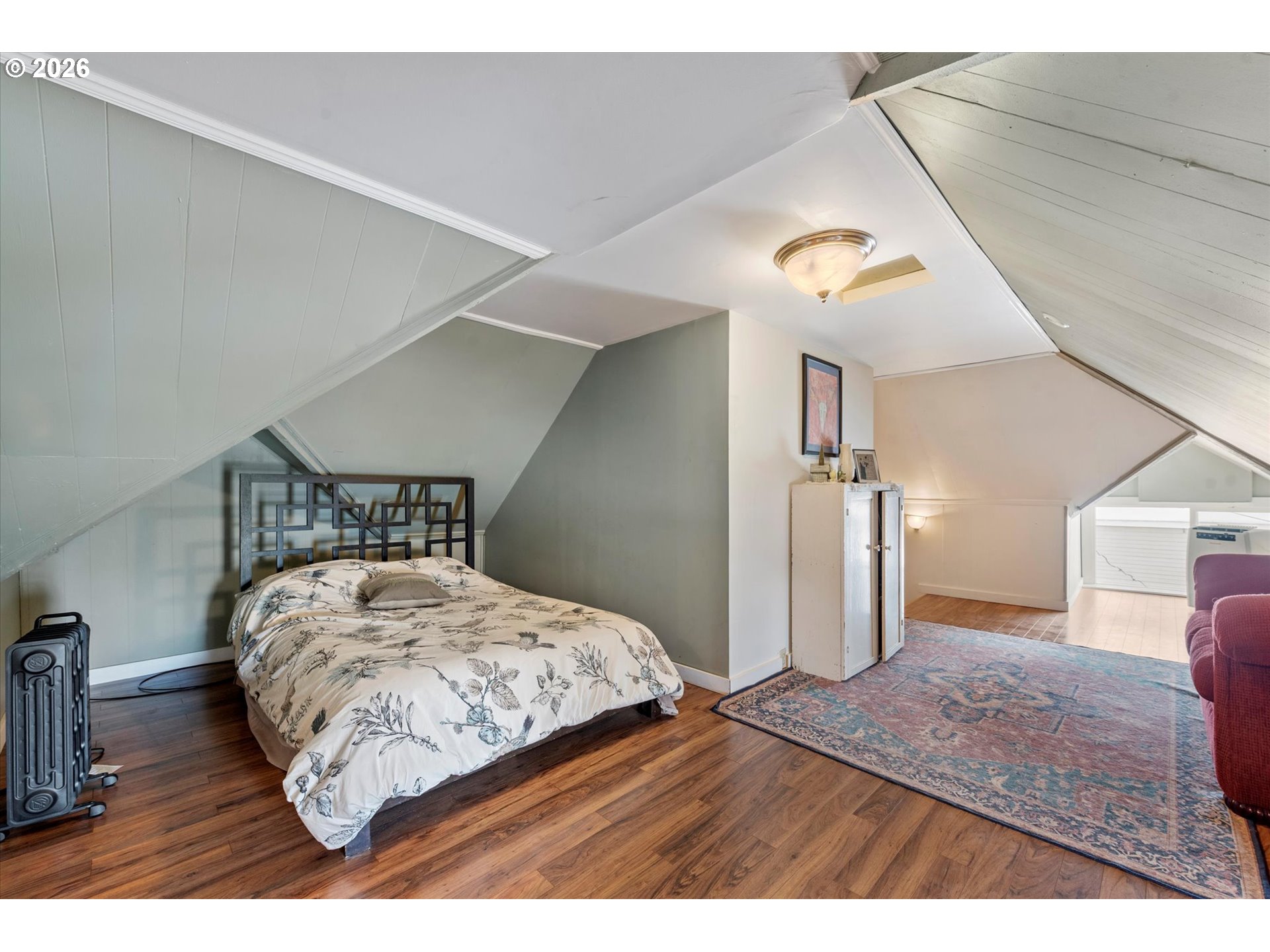 1439 3rd Street Baker City, OR 97814 - Photo 32 of 42 a bedroom with a bed and wooden floor