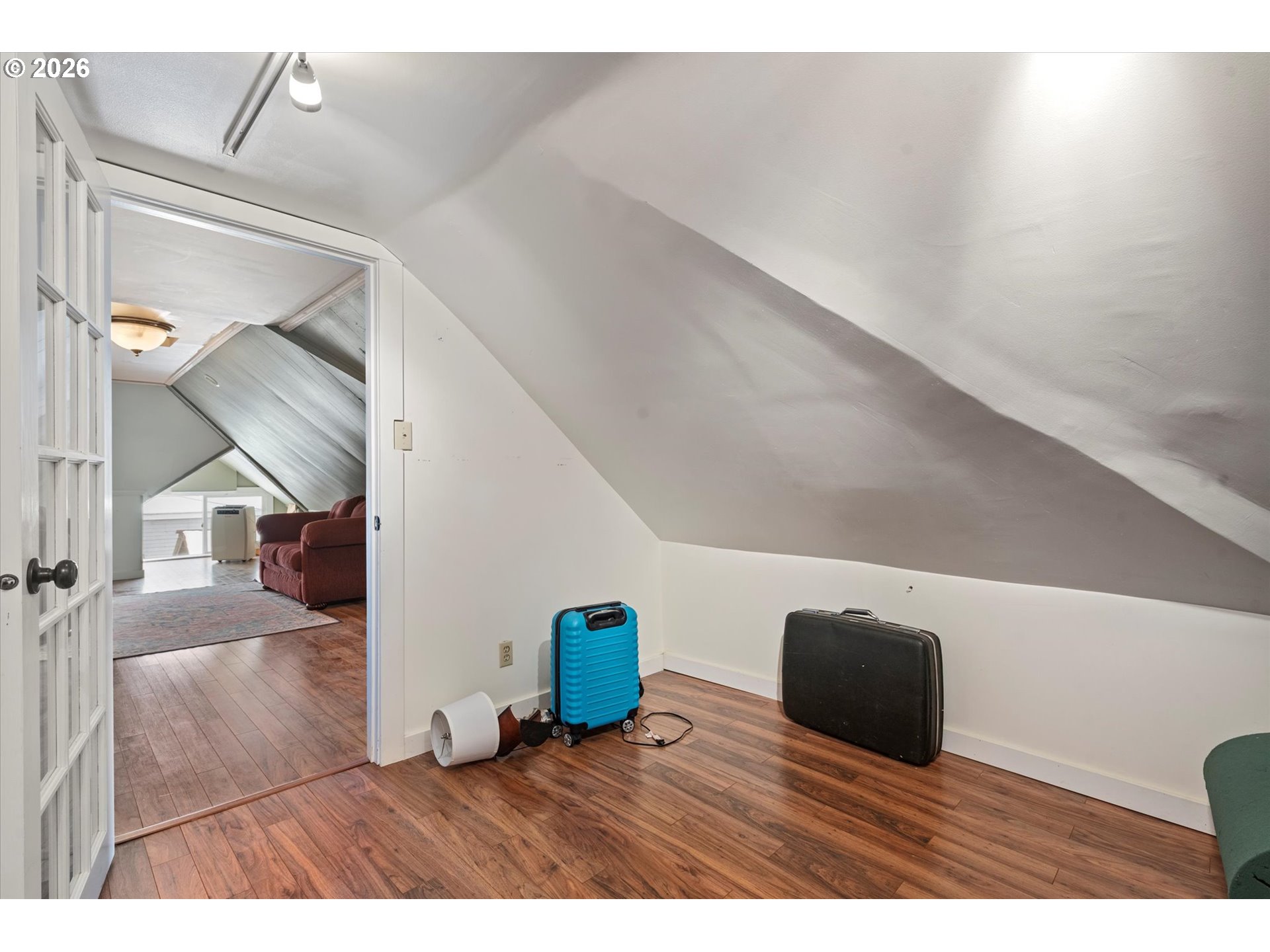 1439 3rd Street Baker City, OR 97814 - Photo 35 of 42 a living room with couches and kitchen view with wooden floor