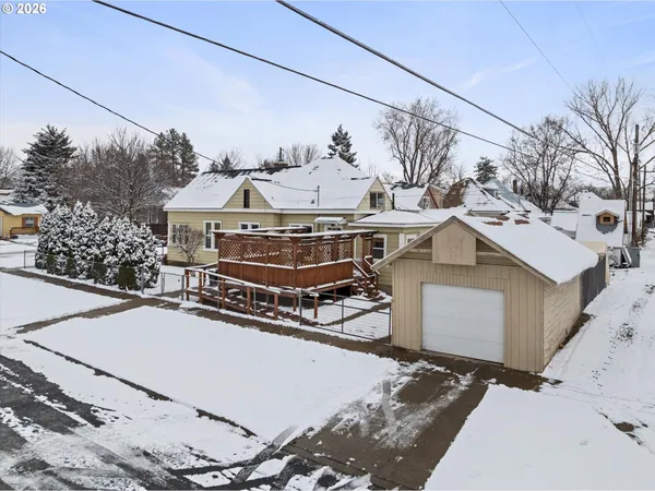 a view of a house with a snow in the background