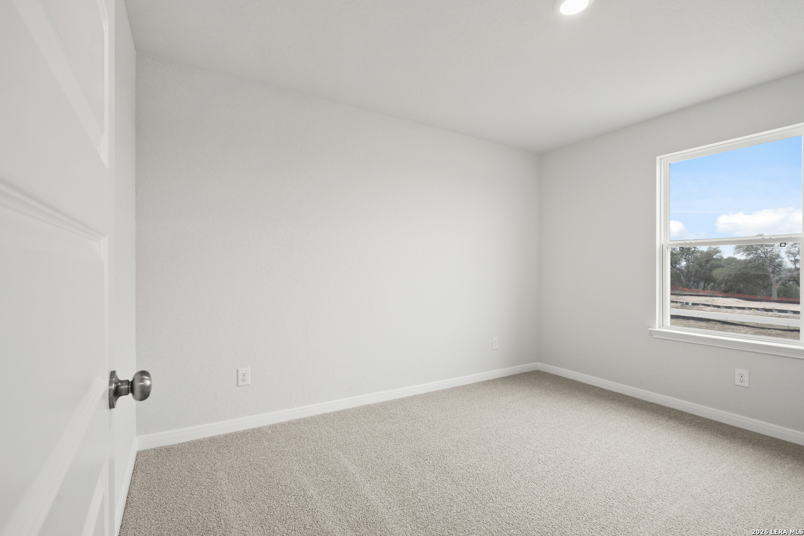 13627 Helton Pass St. Hedwig, TX 78152 - Photo 17 of 33 a view of an empty room with a window
