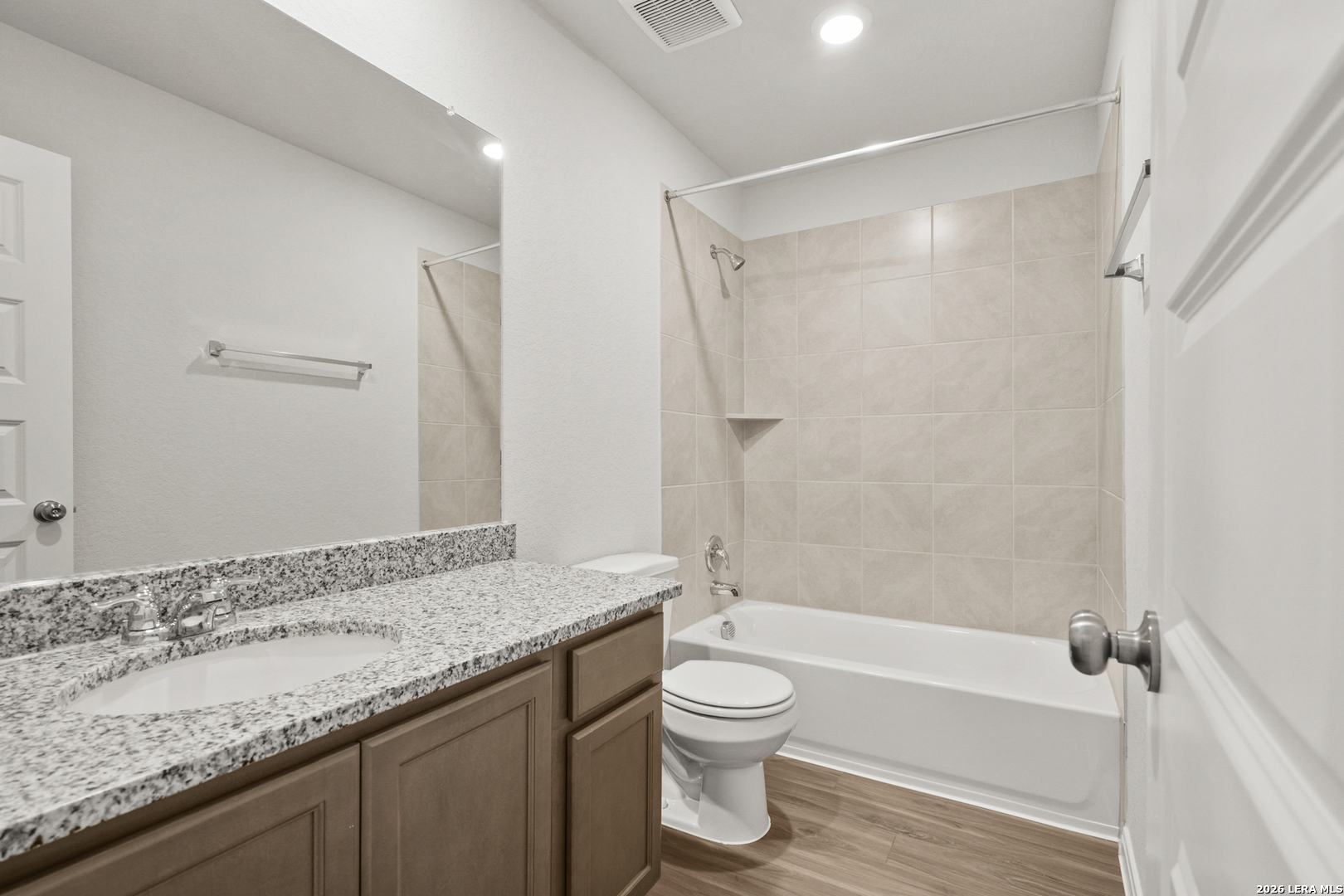 13627 Helton Pass St. Hedwig, TX 78152 - Photo 23 of 33 a bathroom with a granite countertop sink toilet and shower