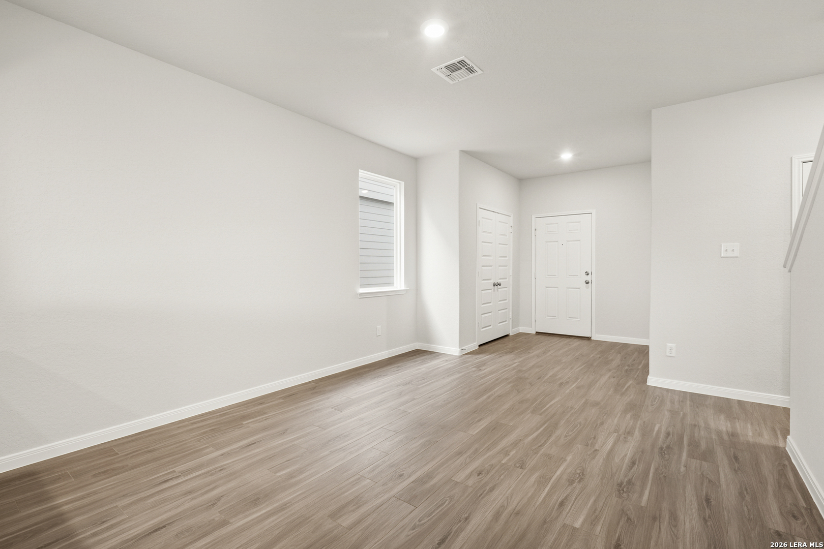 13627 Helton Pass St. Hedwig, TX 78152 - Photo 8 of 33 an empty room with wooden floor