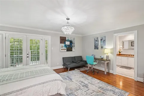 a bedroom with furniture and a window