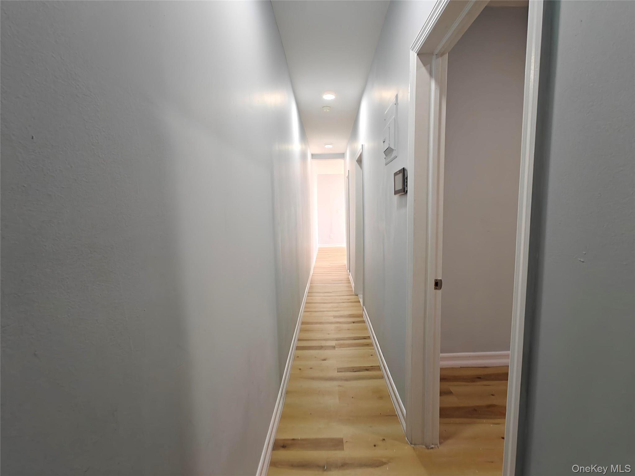 30 Macombs Place, Unit 44 Manhattan, NY 10039 - Photo 3 of 11 a view of a hallway with a glass door