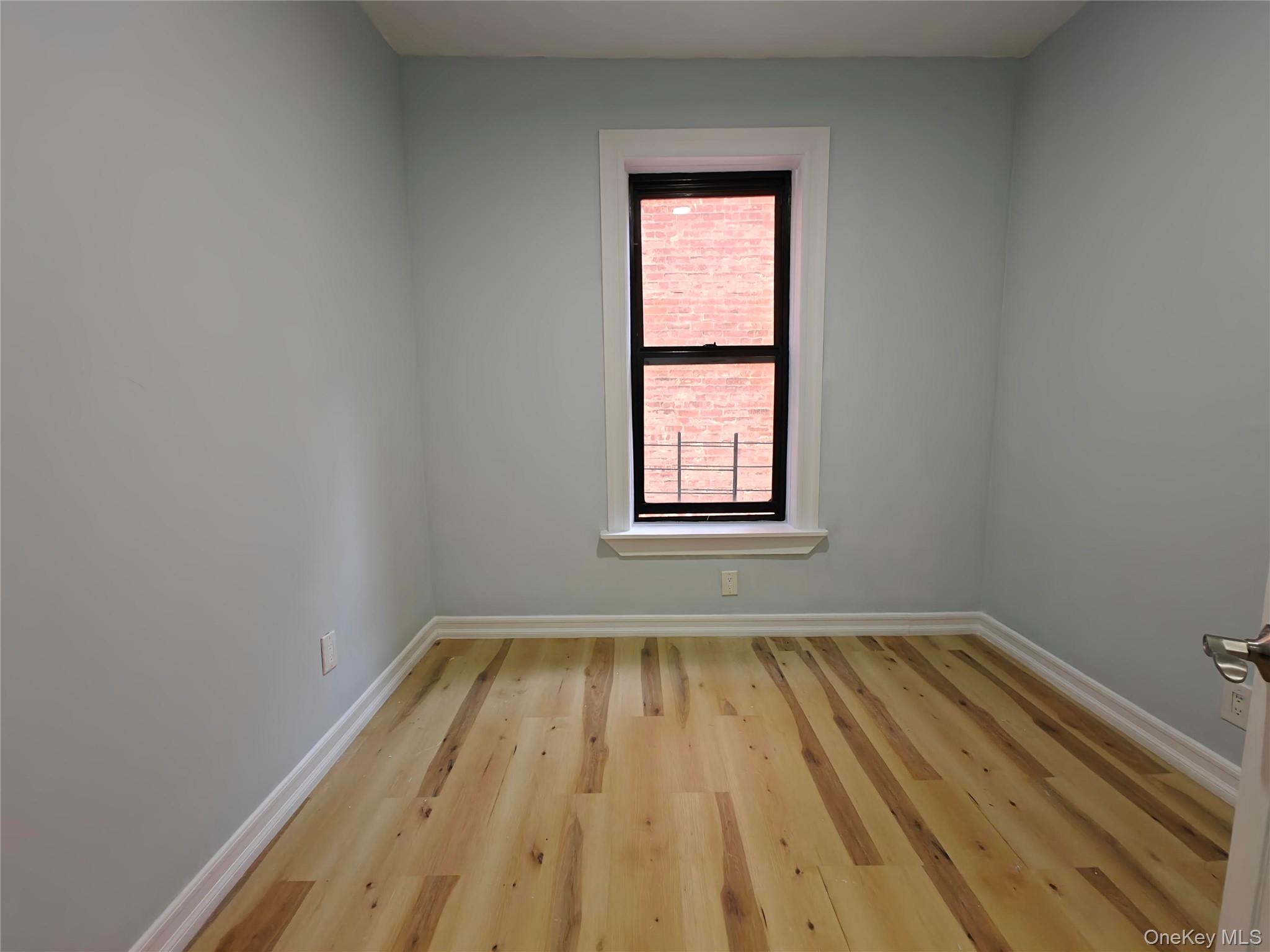 30 Macombs Place, Unit 44 Manhattan, NY 10039 - Photo 7 of 11 an empty room with a window