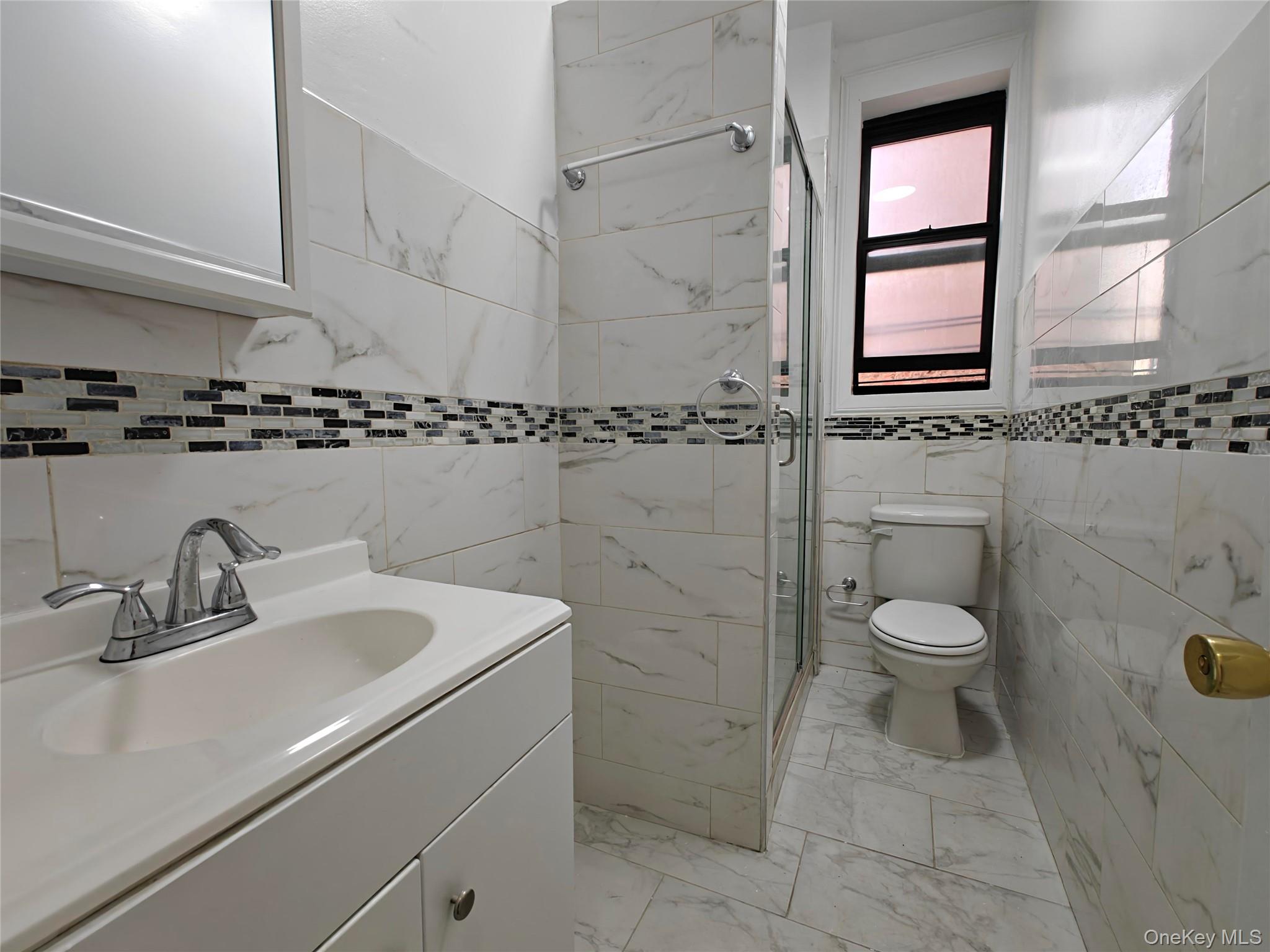 30 Macombs Place, Unit 44 Manhattan, NY 10039 - Photo 10 of 11 a bathroom with a sink toilet and shower