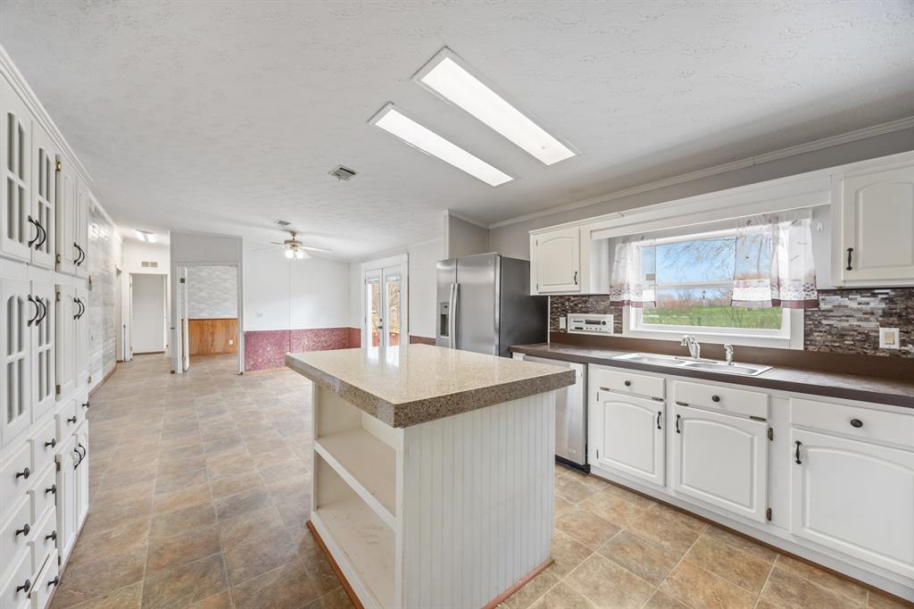 364 Rs County Road 4530 Point, TX 75472 - Photo 18 of 31 a kitchen with sink cabinets and window