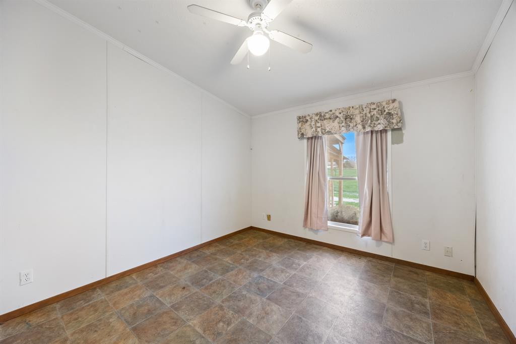 364 Rs County Road 4530 Point, TX 75472 - Photo 22 of 31 an empty room with windows and fan