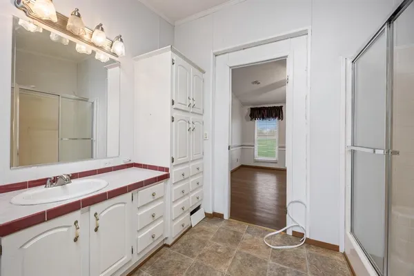 a bathroom with a sink and a mirror