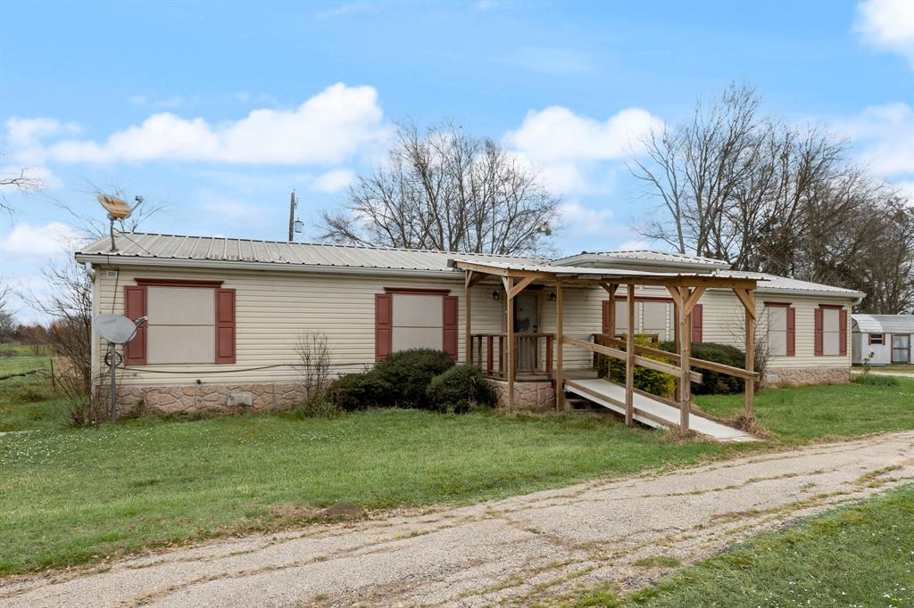 364 Rs County Road 4530 Point, TX 75472 - Photo 8 of 31 a front view of a house with garden