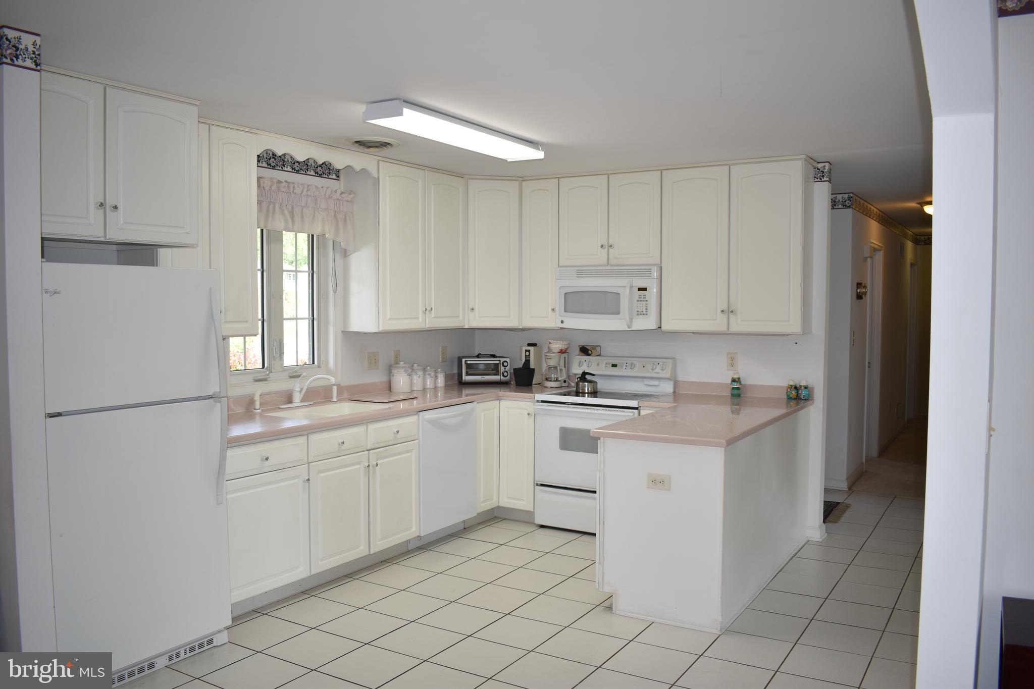 1206 Rabbit Court Hagerstown, MD 21740 - Photo 11 of 35 Modern white cabinets, tile flooring