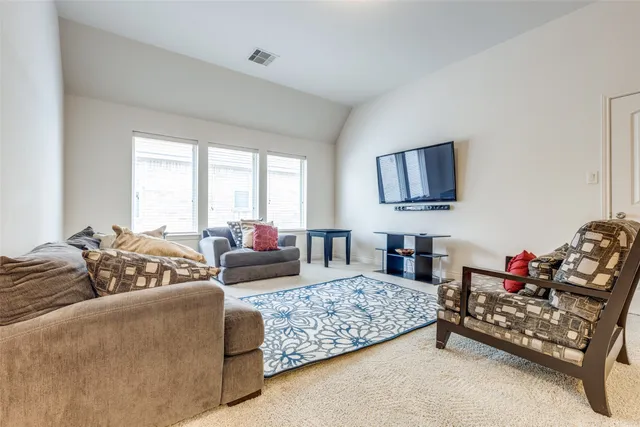 a bedroom with furniture and a couch