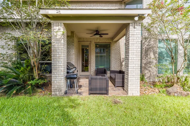 a view of a porch with a chairs and table in a patio