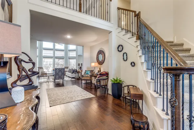 a view of a livingroom with furniture and hardwood floor