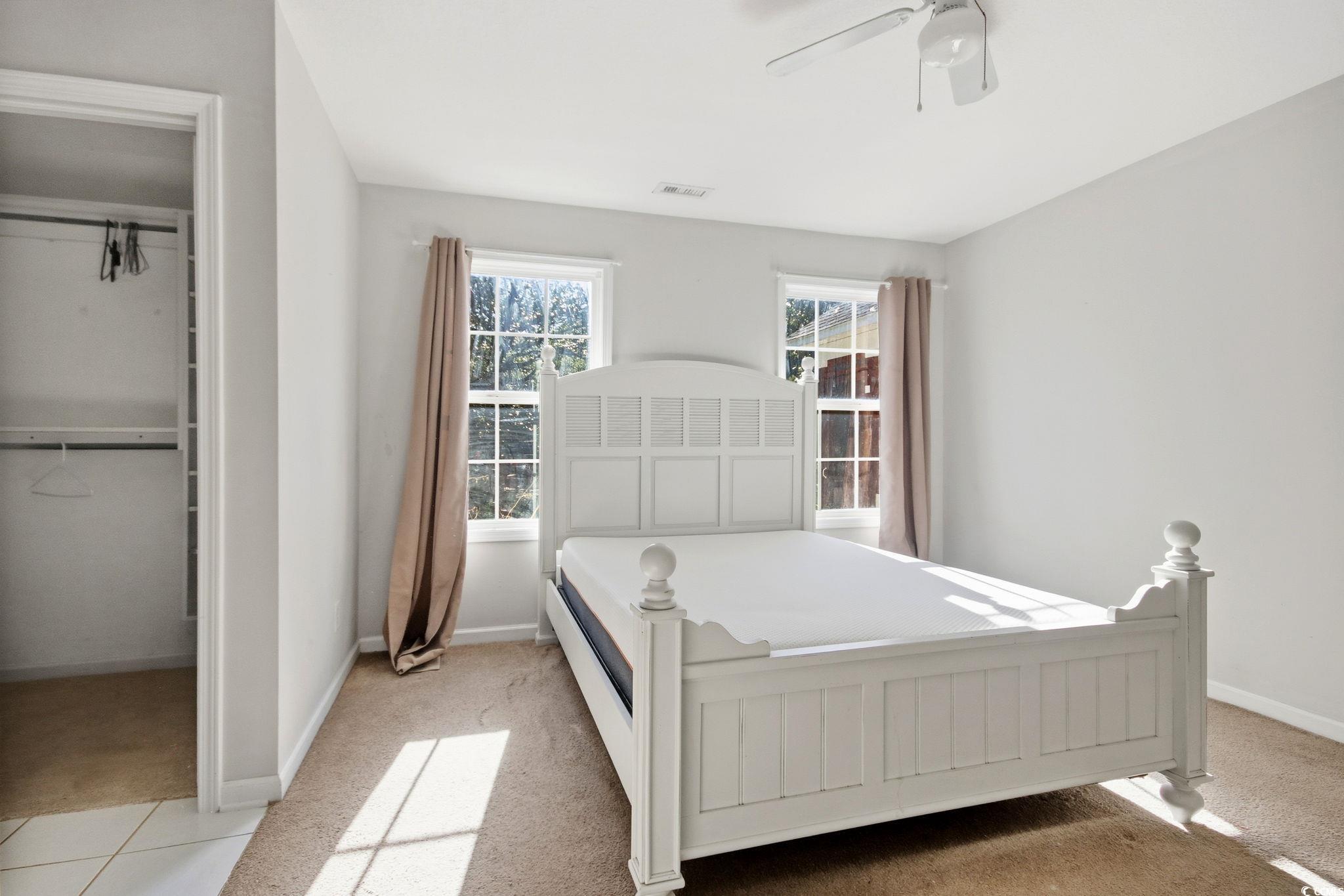 1735 Rice Street Georgetown, SC 29440 - Photo 15 of 34 Carpeted bedroom featuring a closet and ceiling fan