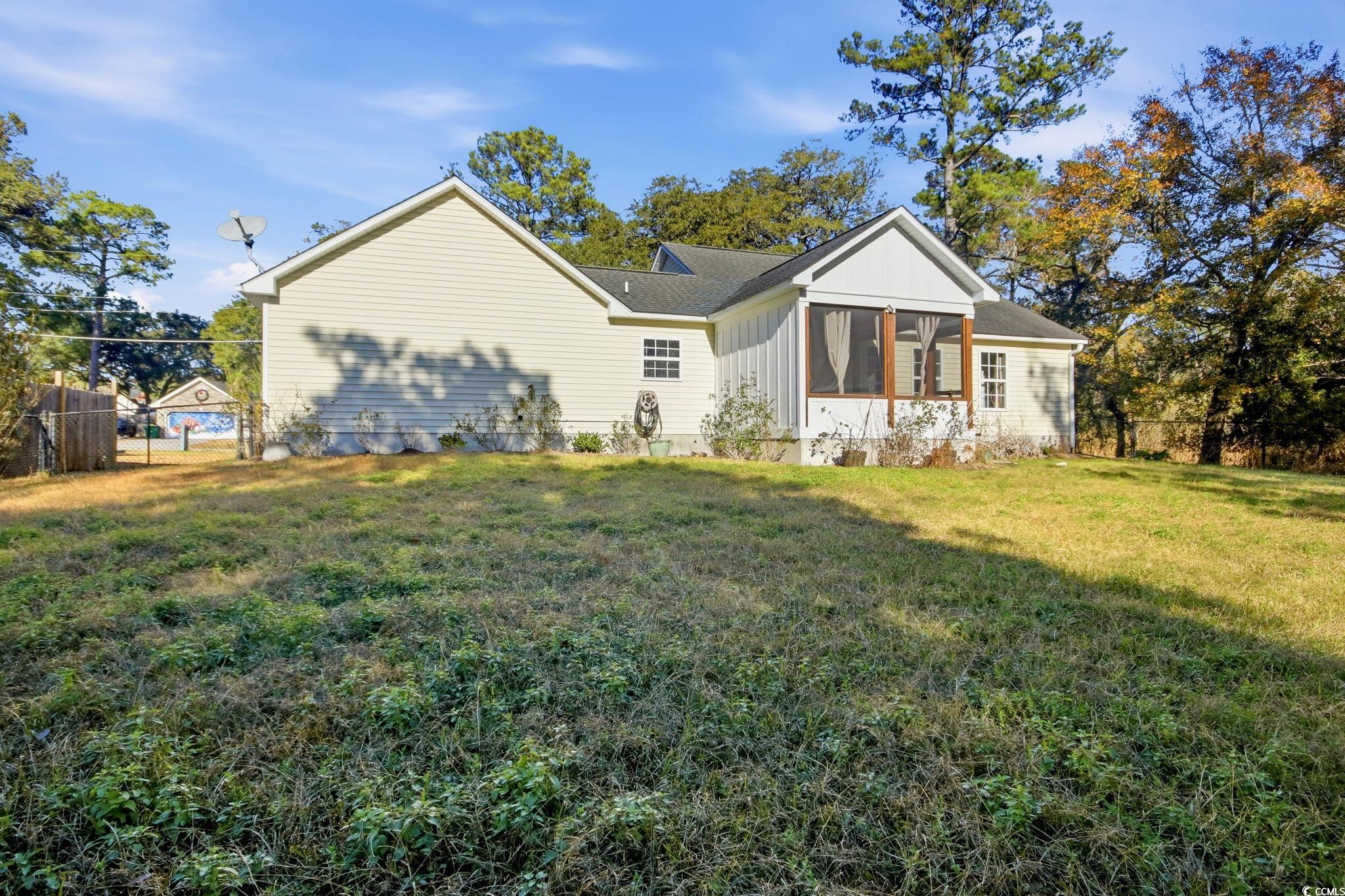 1735 Rice Street Georgetown, SC 29440 - Photo 29 of 34 View of side of property with a sunroom
