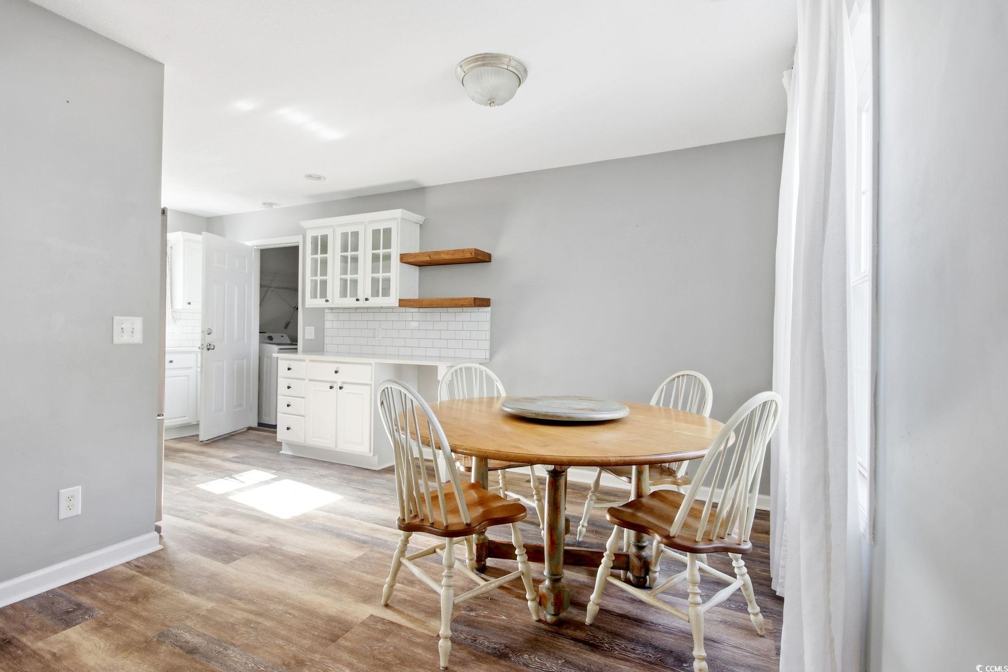 1735 Rice Street Georgetown, SC 29440 - Photo 7 of 34 Dining room featuring light wood-type flooring and washer / dryer